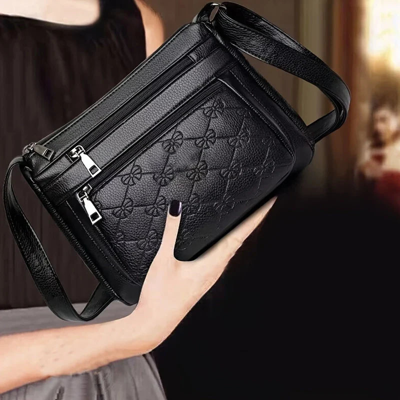 URBAN EDGE™ — BLACK CROSSBODY BAG WITH EMBOSSED GEOMETRIC PATTERN