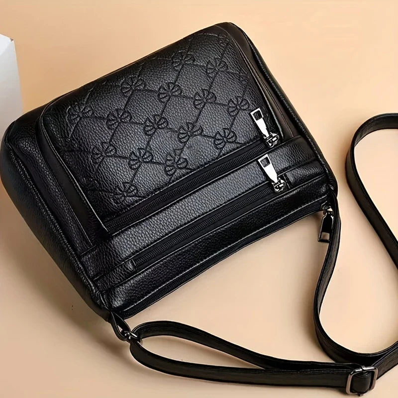 URBAN EDGE™ — BLACK CROSSBODY BAG WITH EMBOSSED GEOMETRIC PATTERN